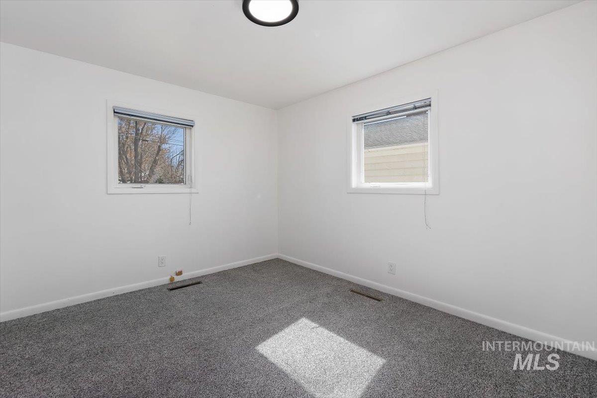 1214 H Street Rupert, ID 83350 - Photo 25 of 35 Carpeted empty room with healthy amount of natural light