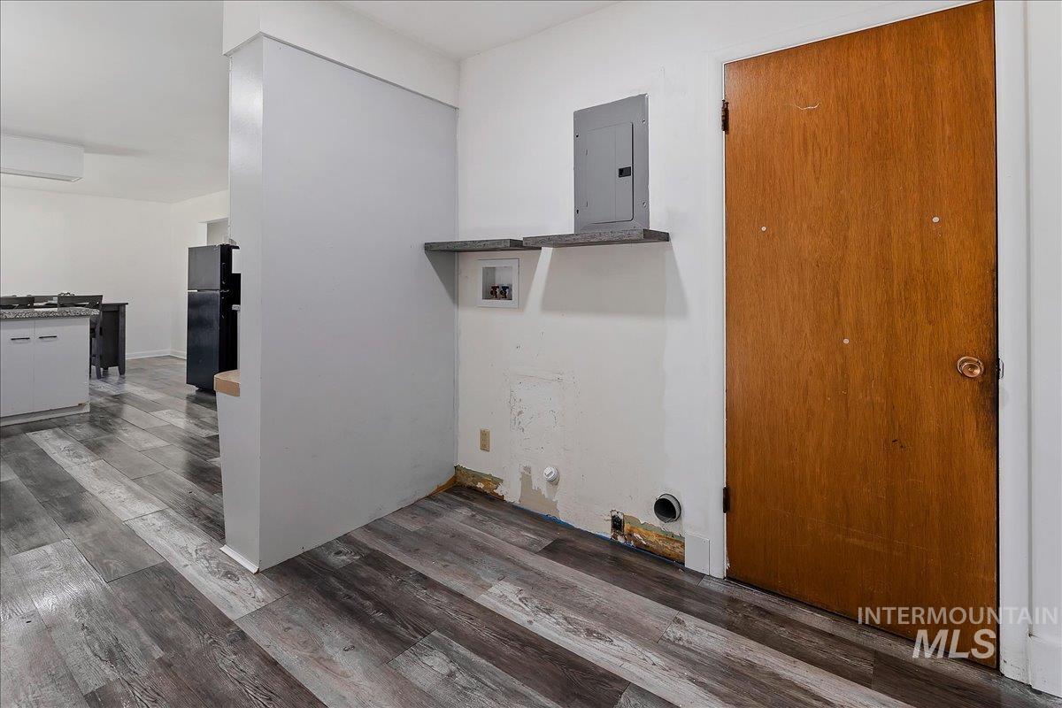 1214 H Street Rupert, ID 83350 - Photo 28 of 35 Laundry area with hardwood / wood-style flooring, electric panel, hookup for a washing machine, and gas dryer hookup