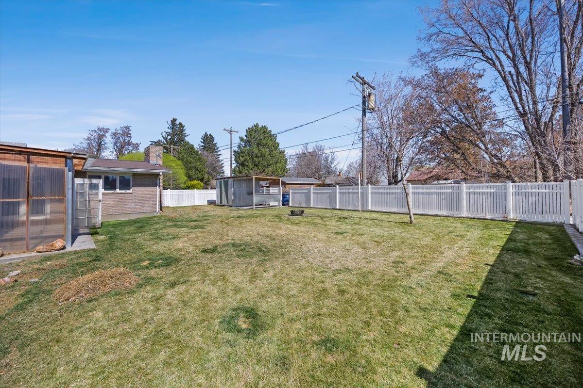 1214 H Street Rupert, ID 83350 - Photo 32 of 35 Fenced backyard with an outbuilding