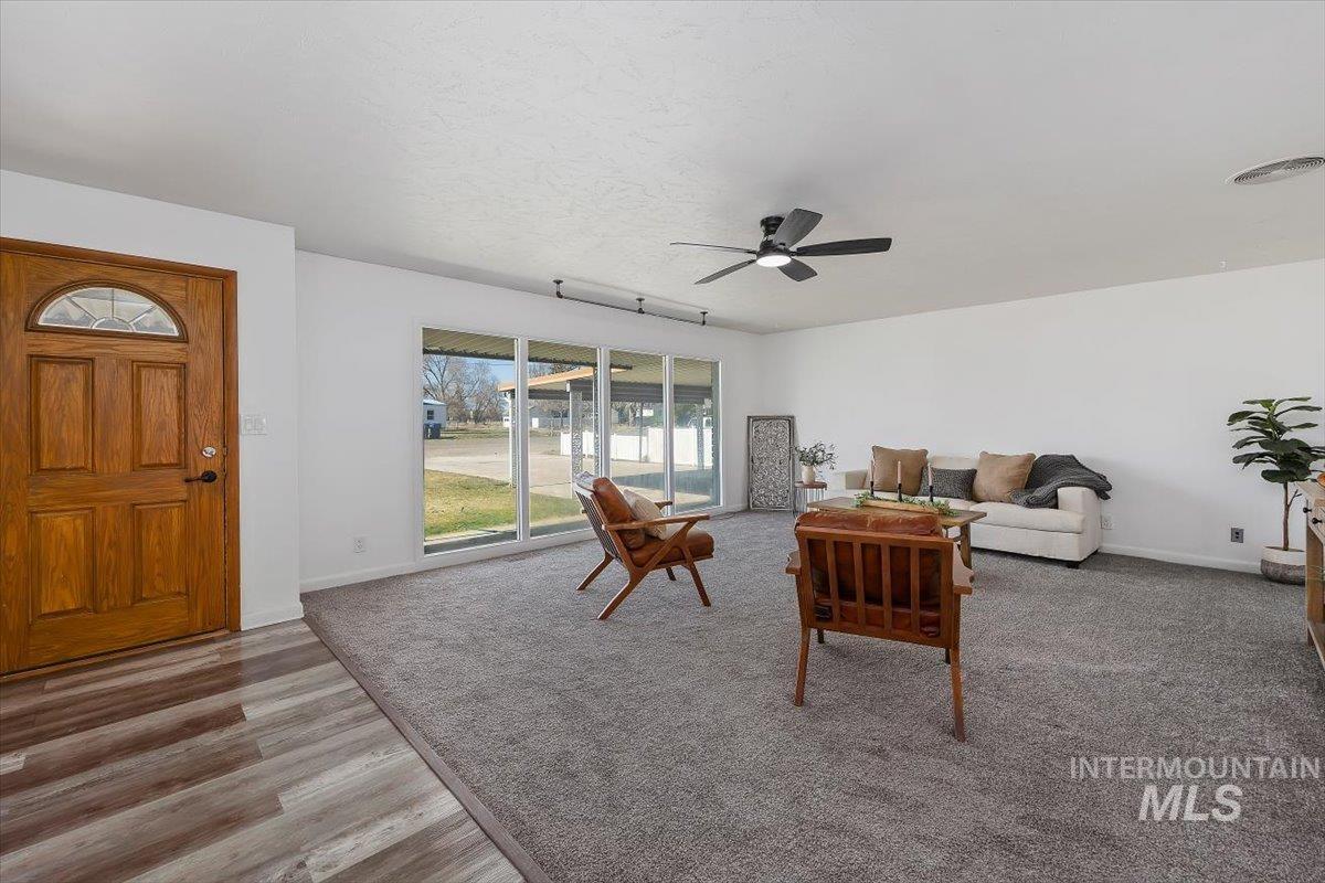 1214 H Street Rupert, ID 83350 - Photo 8 of 35 Living room with a ceiling fan and wood finished floors