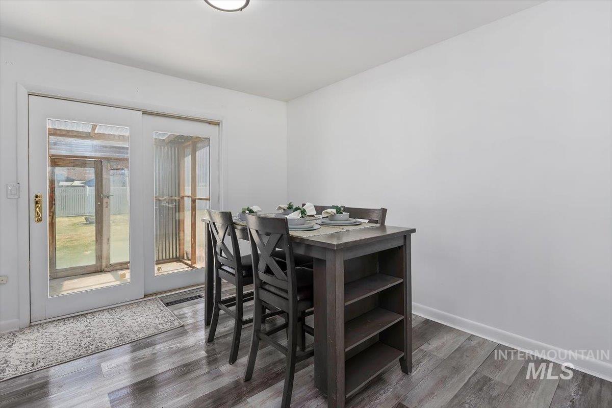 1214 H Street Rupert, ID 83350 - Photo 10 of 35 Dining area featuring light wood-type flooring and baseboards