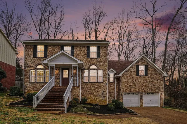 a front view of a house with yard