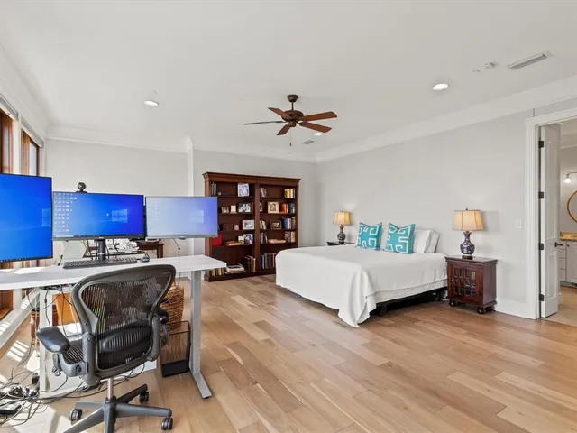 a living room with furniture and floor to ceiling window