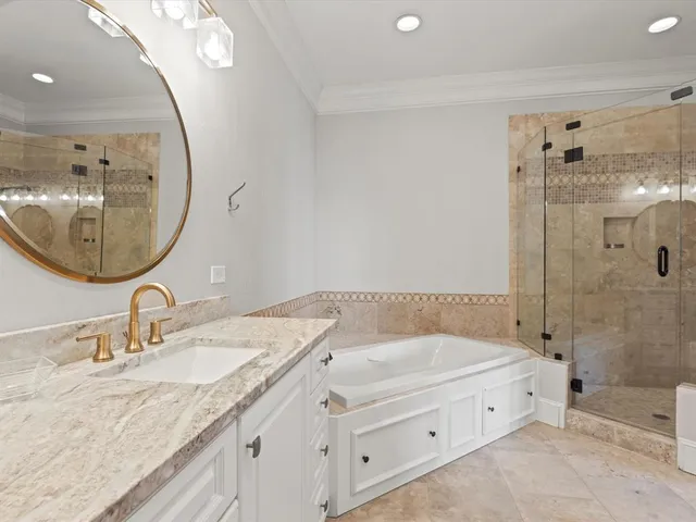 an empty room with windows and ceiling fan