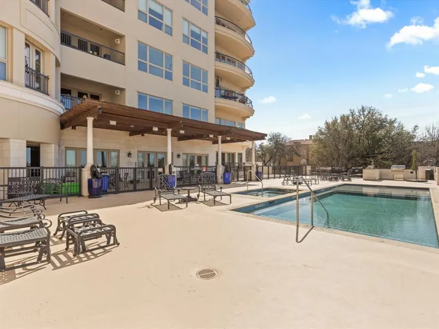a view of a balcony with yard