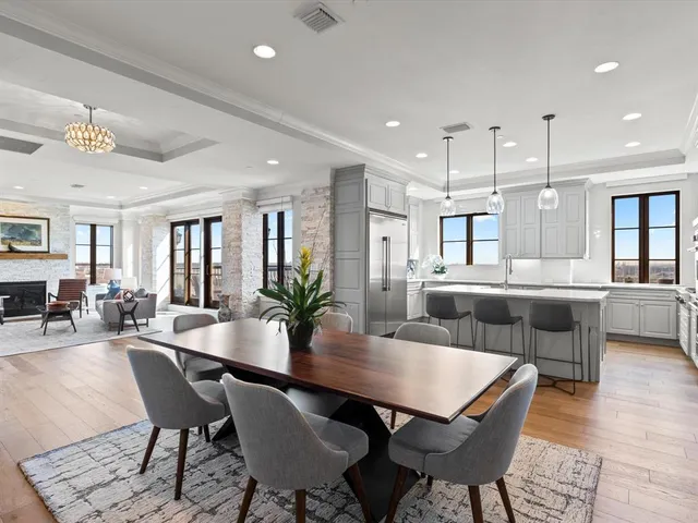 a dining area with furniture and window