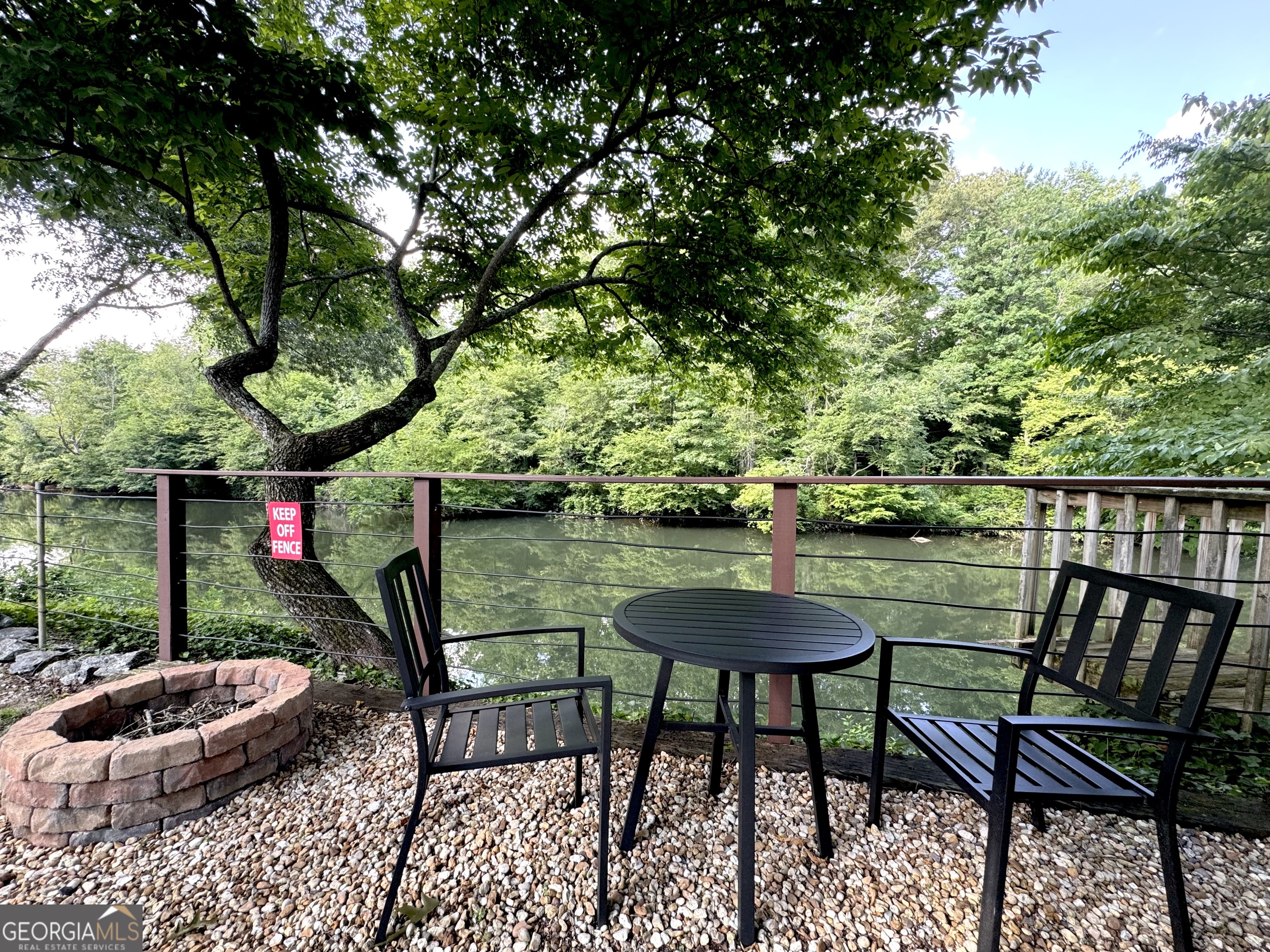 a view of a chairs and table in the patio