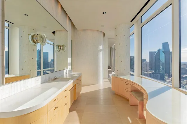a large spacious bathroom with a large tub shower and sink