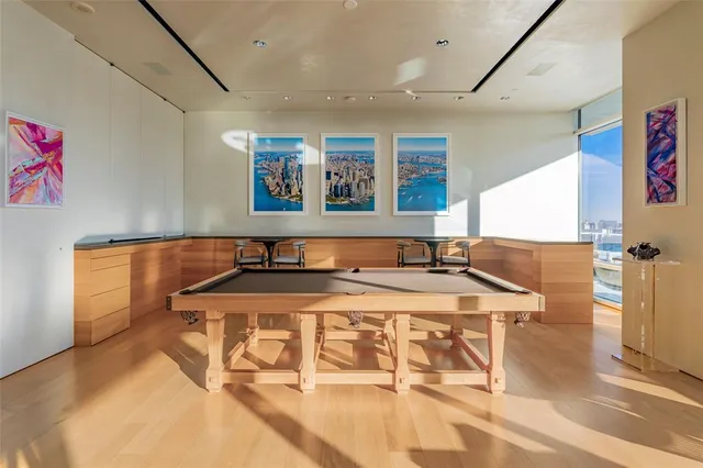 a living room with stainless steel appliances kitchen island granite countertop furniture and a view of living room