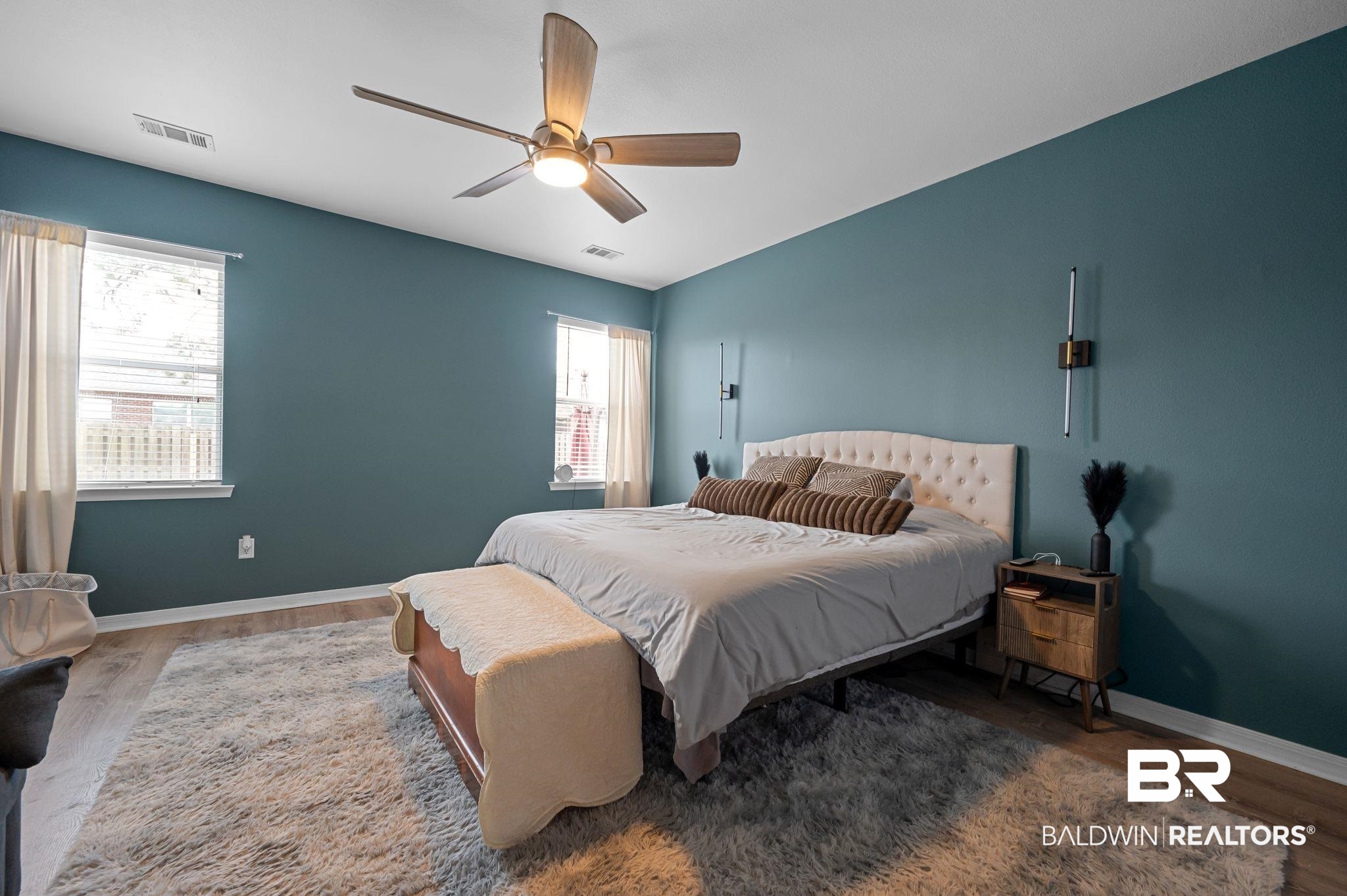 1287 Pembroke Way Foley, AL 36535 - Photo 20 of 39 Bedroom featuring multiple windows, wood finished floors, and ceiling fan