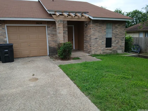 front view of a house with a yard