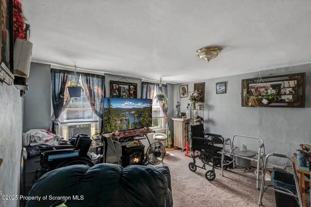 a kitchen with lots of clutter and cabinets