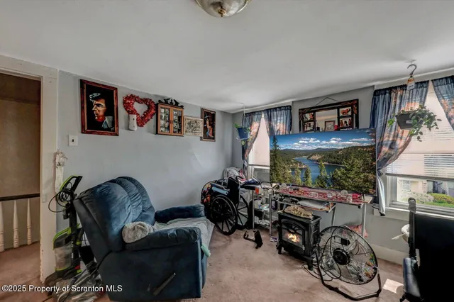a kitchen with a refrigerator and a stove top oven