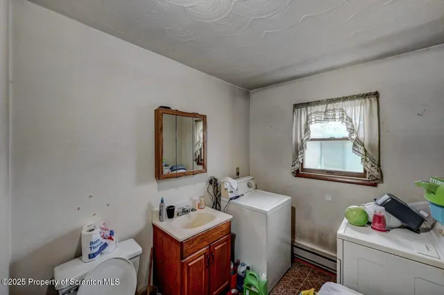 a view of a hallway with seating area
