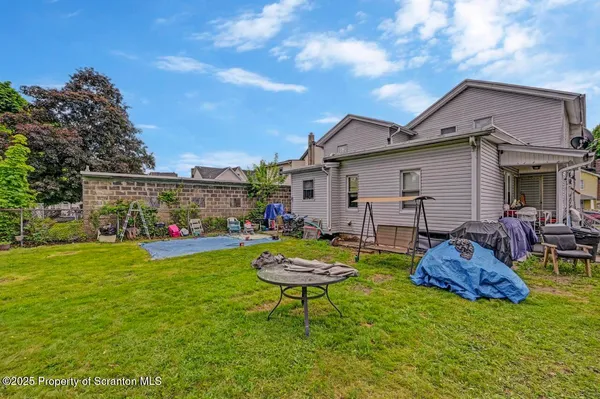 a front view of house with yard outdoor seating and green space