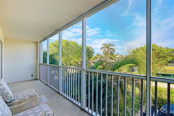 a view of a balcony with chair
