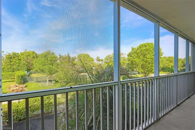 a view of a balcony with chair
