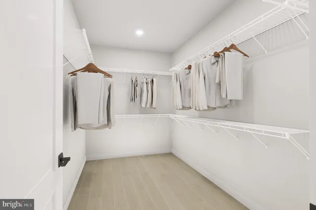 a bathroom with a shower sink and mirror