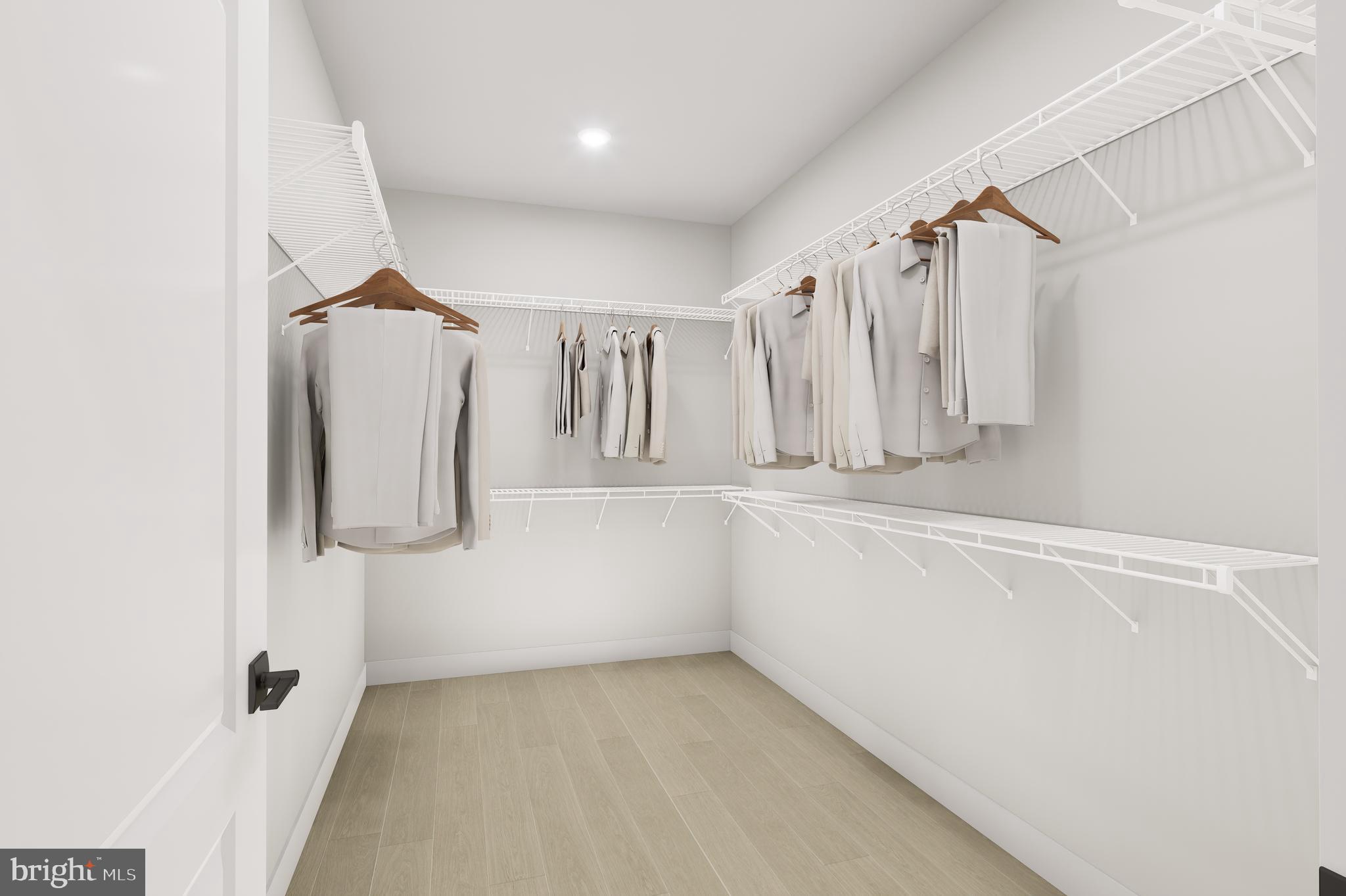 1121 Fortune Terrace, Unit 2 Potomac, MD 20854 - Photo 8 of 12 a view of walk in closet with clothes and shoes