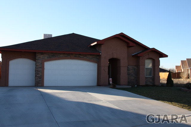 a front view of a house with a garage