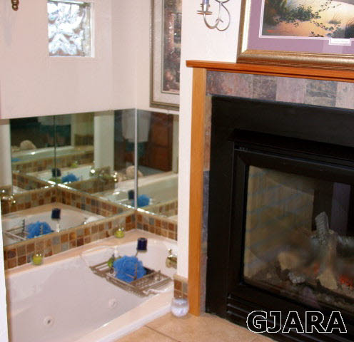 353 Belden Court Fruita, CO 81521 - Photo 11 of 16 a kitchen with granite countertop cabinets and outdoor view