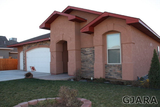 353 Belden Court Fruita, CO 81521 - Photo 2 of 16 a front view of house with garden