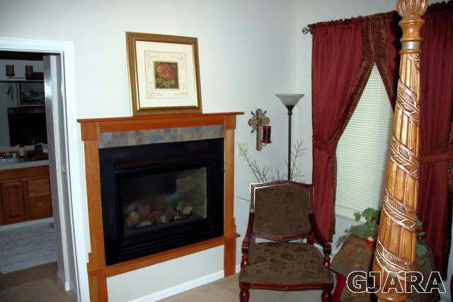 353 Belden Court Fruita, CO 81521 - Photo 10 of 16 a living room with furniture and a fireplace