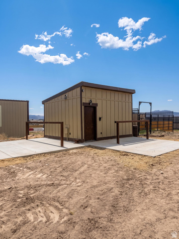115 East 1600th Street North Santaquin, UT 84655 - Photo 35 of 52 Freestanding structure with panel siding and a dark roofline