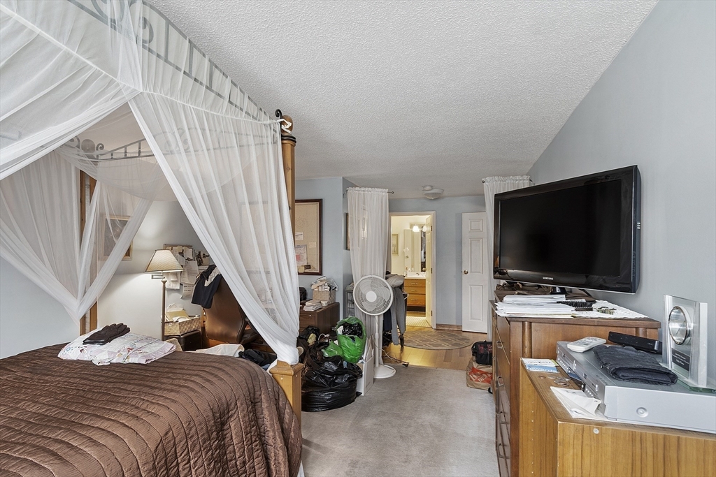 154 Lynnway, Unit 205 Lynn, MA 01902 - Photo 14 of 29 a view of a livingroom with furniture and a flat screen tv