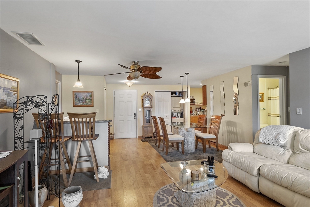 154 Lynnway, Unit 205 Lynn, MA 01902 - Photo 25 of 29 a living room with furniture wooden floor and dining table