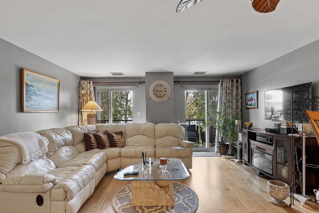 154 Lynnway, Unit 205 Lynn, MA 01902 - Photo 9 of 29 a living room with furniture and a large window