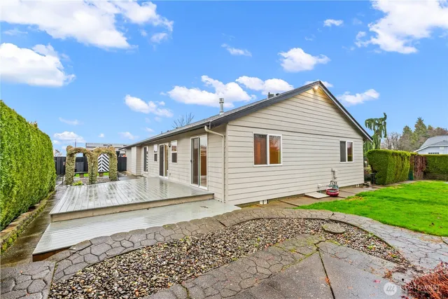 a view of a backyard with sitting area