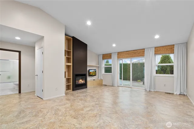 a view of a livingroom with furniture and a fireplace