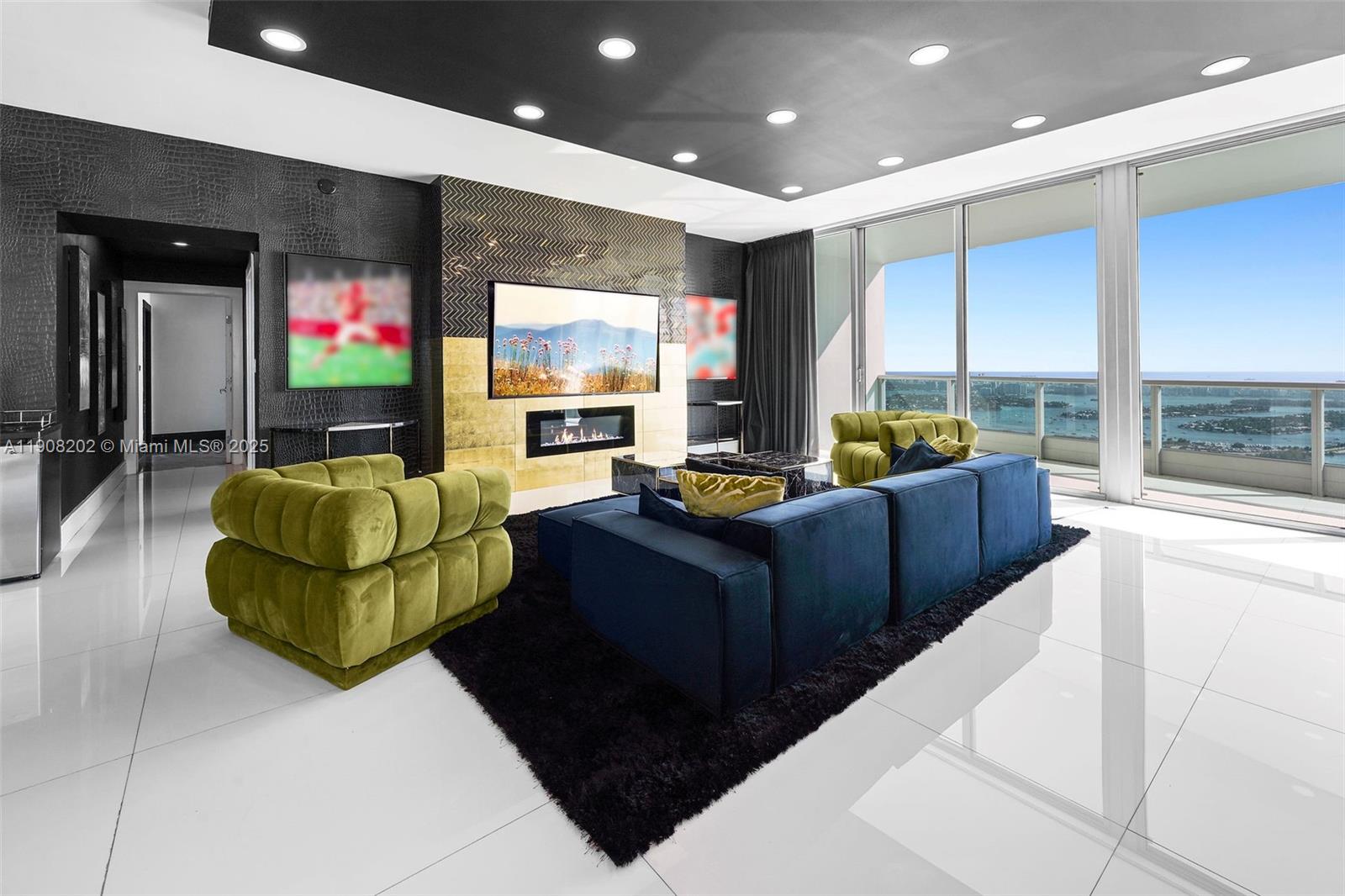 900 Biscayne Boulevard, Unit PH6201 Miami, FL 33132 - Photo 12 of 73 a living room with furniture and a flat screen tv