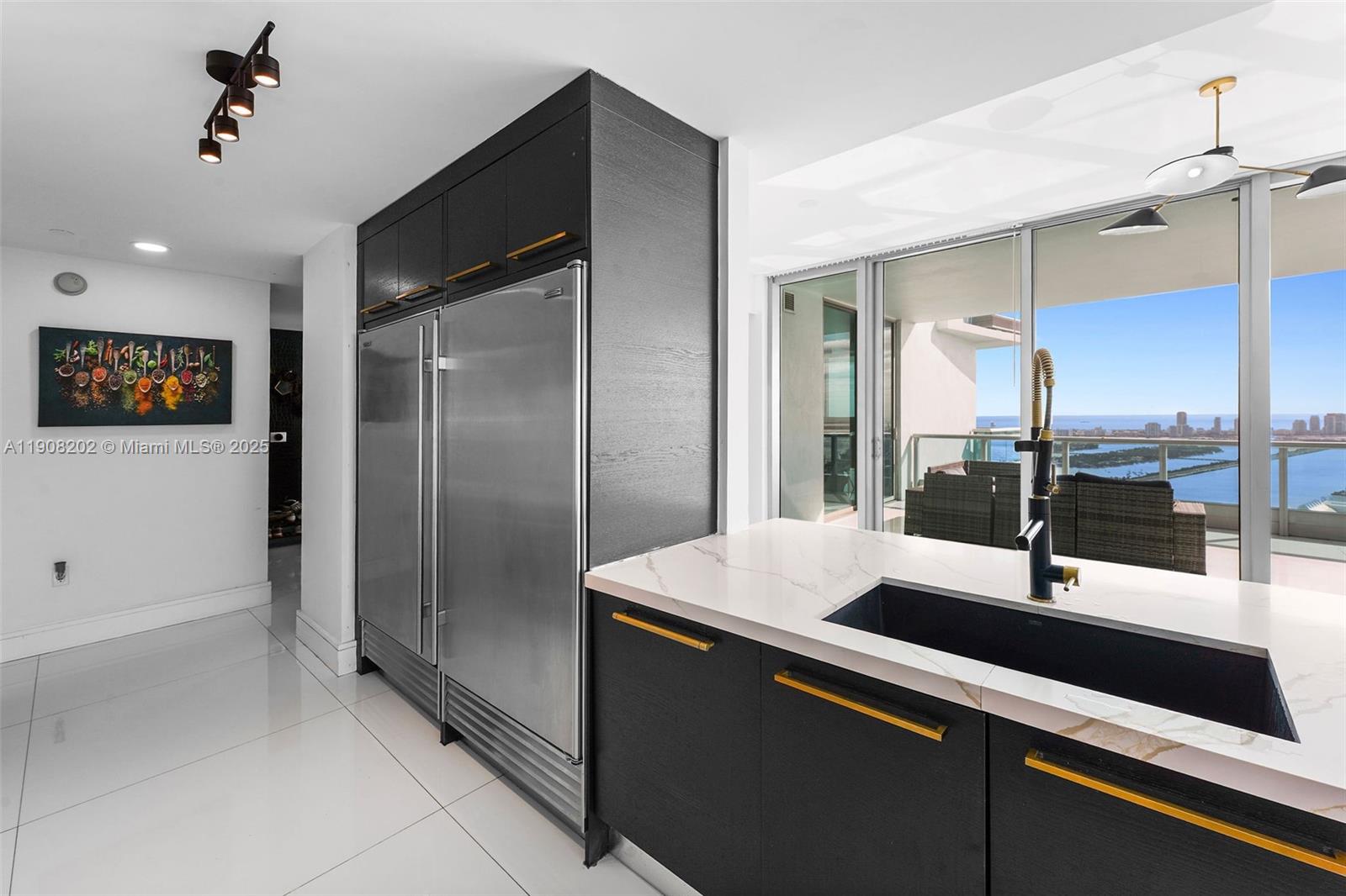 900 Biscayne Boulevard, Unit PH6201 Miami, FL 33132 - Photo 24 of 73 a kitchen with stainless steel appliances a sink and a refrigerator