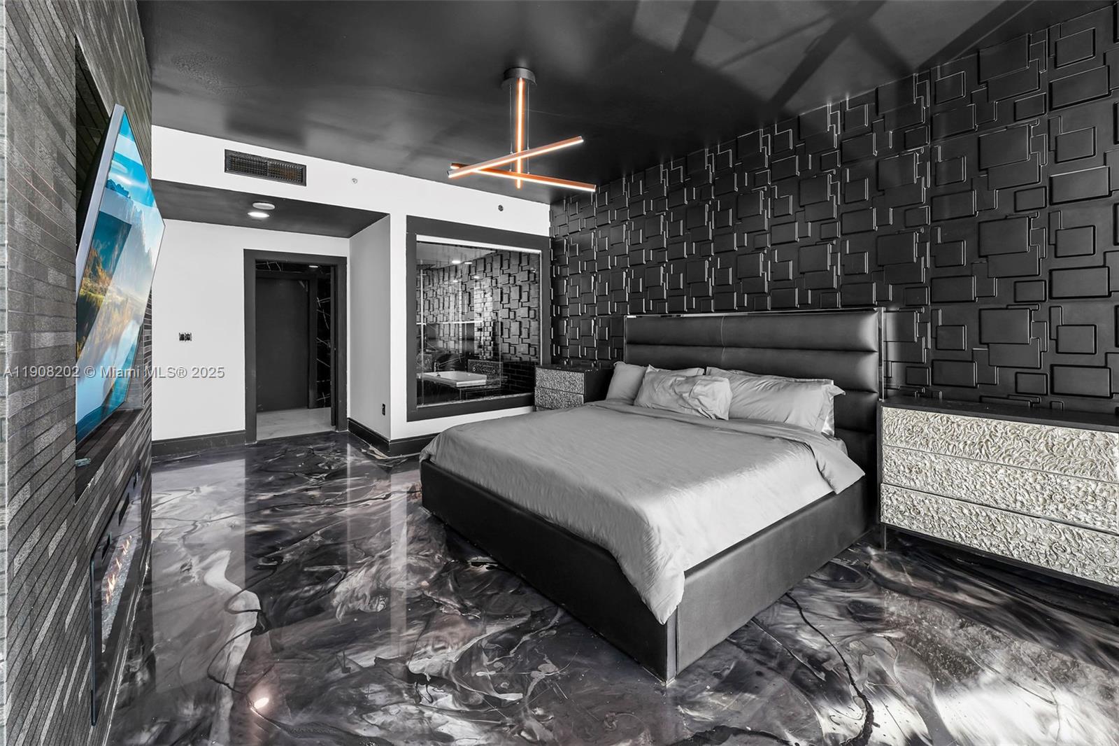 900 Biscayne Boulevard, Unit PH6201 Miami, FL 33132 - Photo 25 of 73 a spacious bedroom with a bed and a dresser