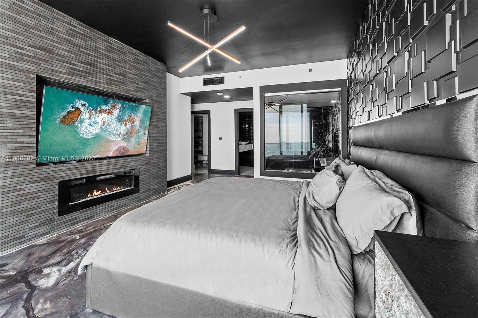 900 Biscayne Boulevard, Unit PH6201 Miami, FL 33132 - Photo 26 of 73 a living room with furniture and a flat screen tv