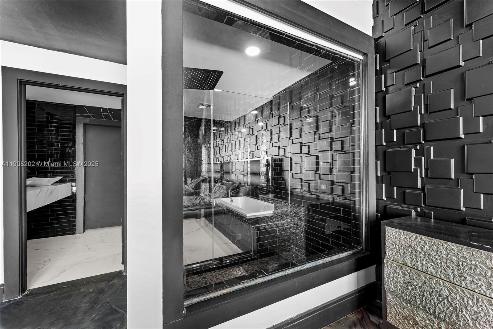 900 Biscayne Boulevard, Unit PH6201 Miami, FL 33132 - Photo 30 of 73 a bathroom with a glass shower door