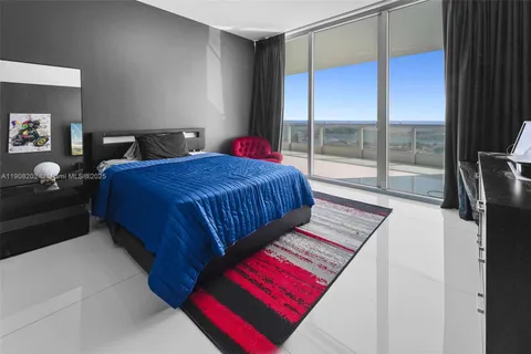 a bed room with a bed and a mirror