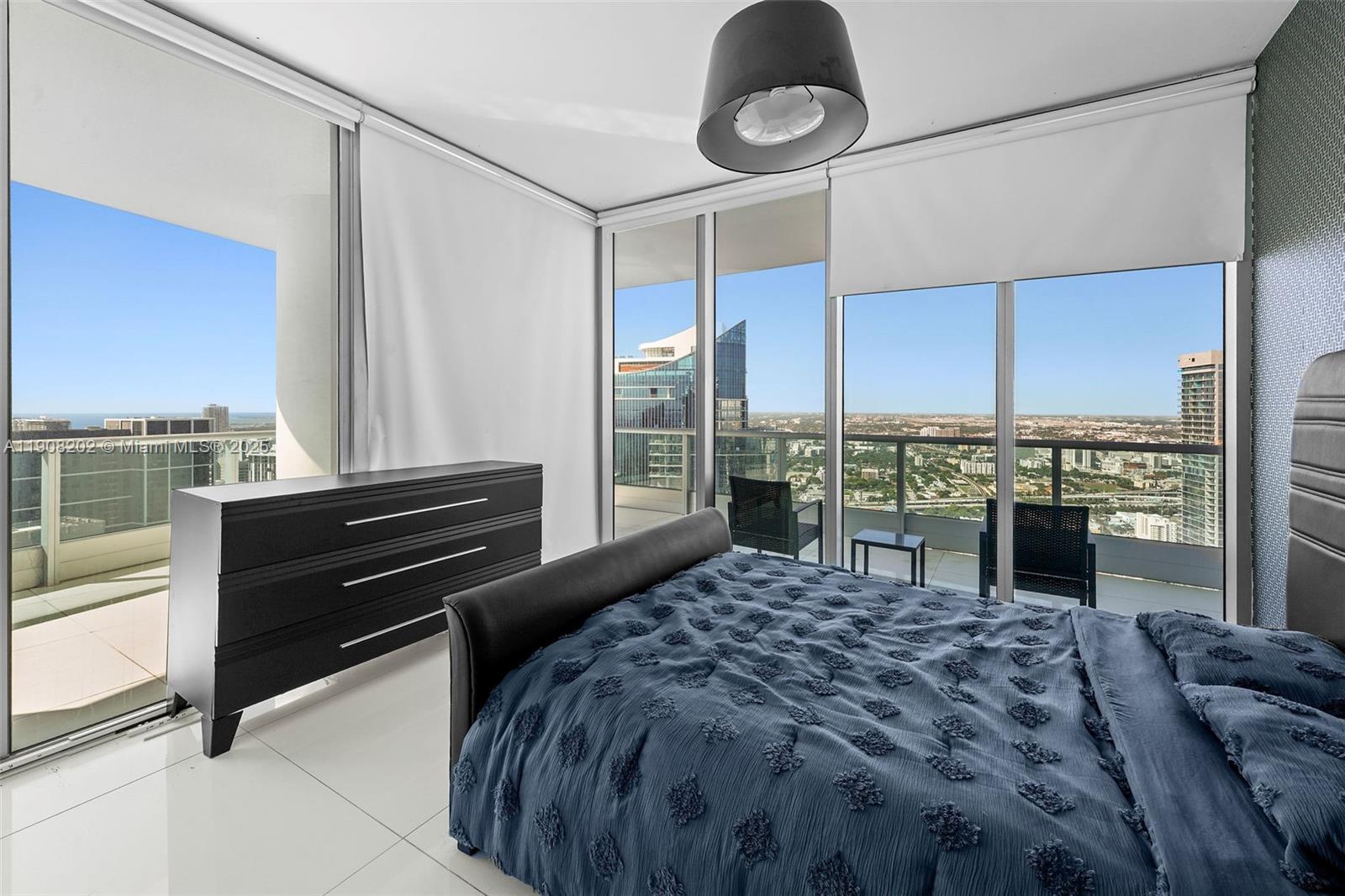 900 Biscayne Boulevard, Unit PH6201 Miami, FL 33132 - Photo 40 of 73 a bedroom with a bed and large window