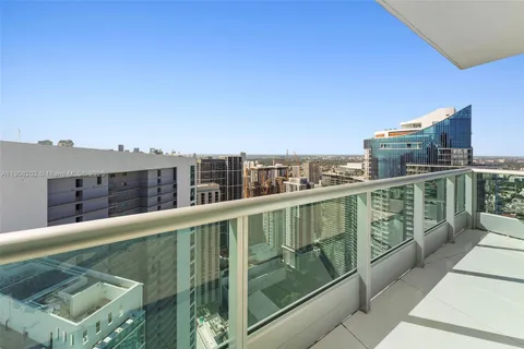 a view of a livingroom with furniture and a flat screen tv