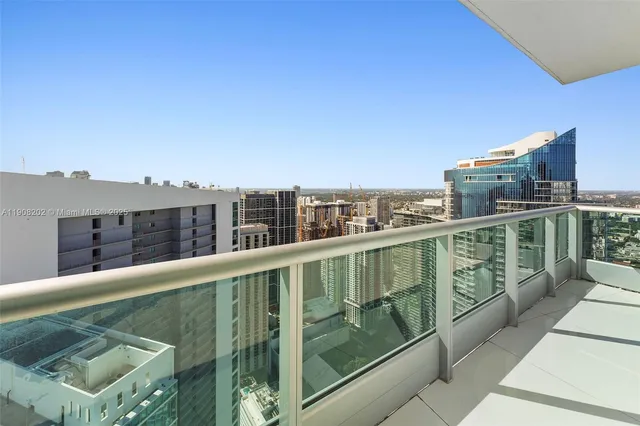 a view of a livingroom with furniture and a flat screen tv