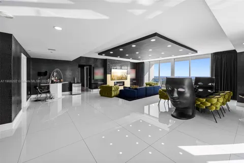 a living room with furniture and a rug