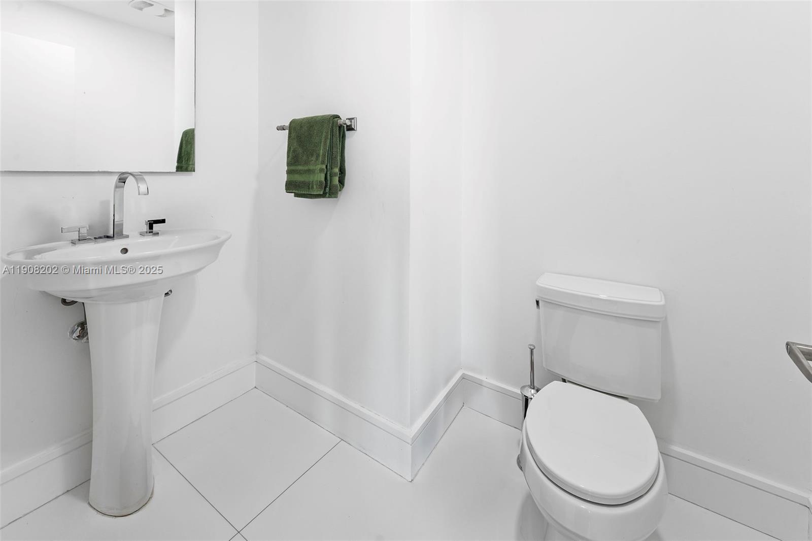 900 Biscayne Boulevard, Unit PH6201 Miami, FL 33132 - Photo 54 of 73 a white toilet sitting next to a bathroom sink