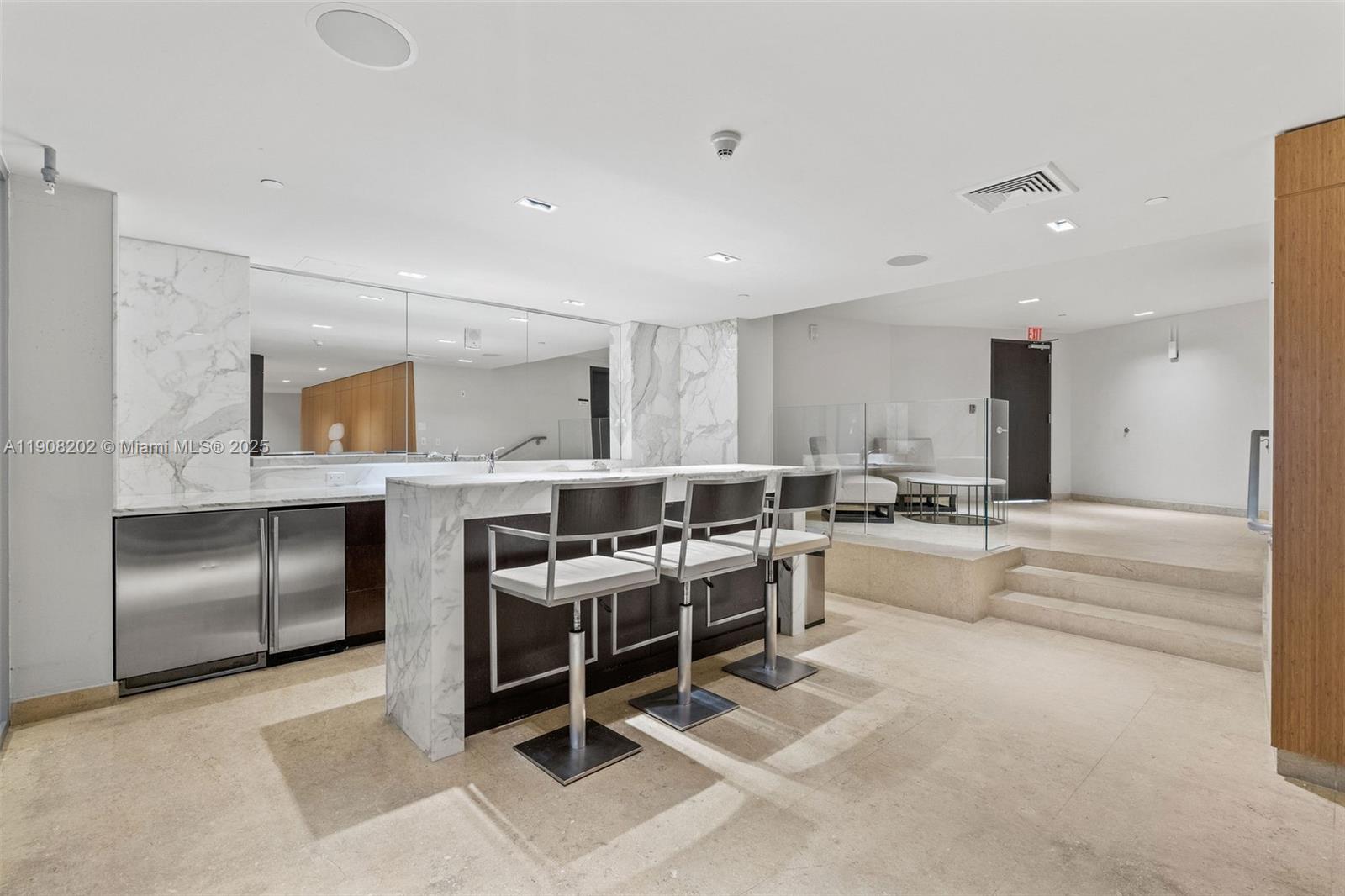 900 Biscayne Boulevard, Unit PH6201 Miami, FL 33132 - Photo 59 of 73 a large white kitchen with a large counter top stainless steel appliances and cabinets