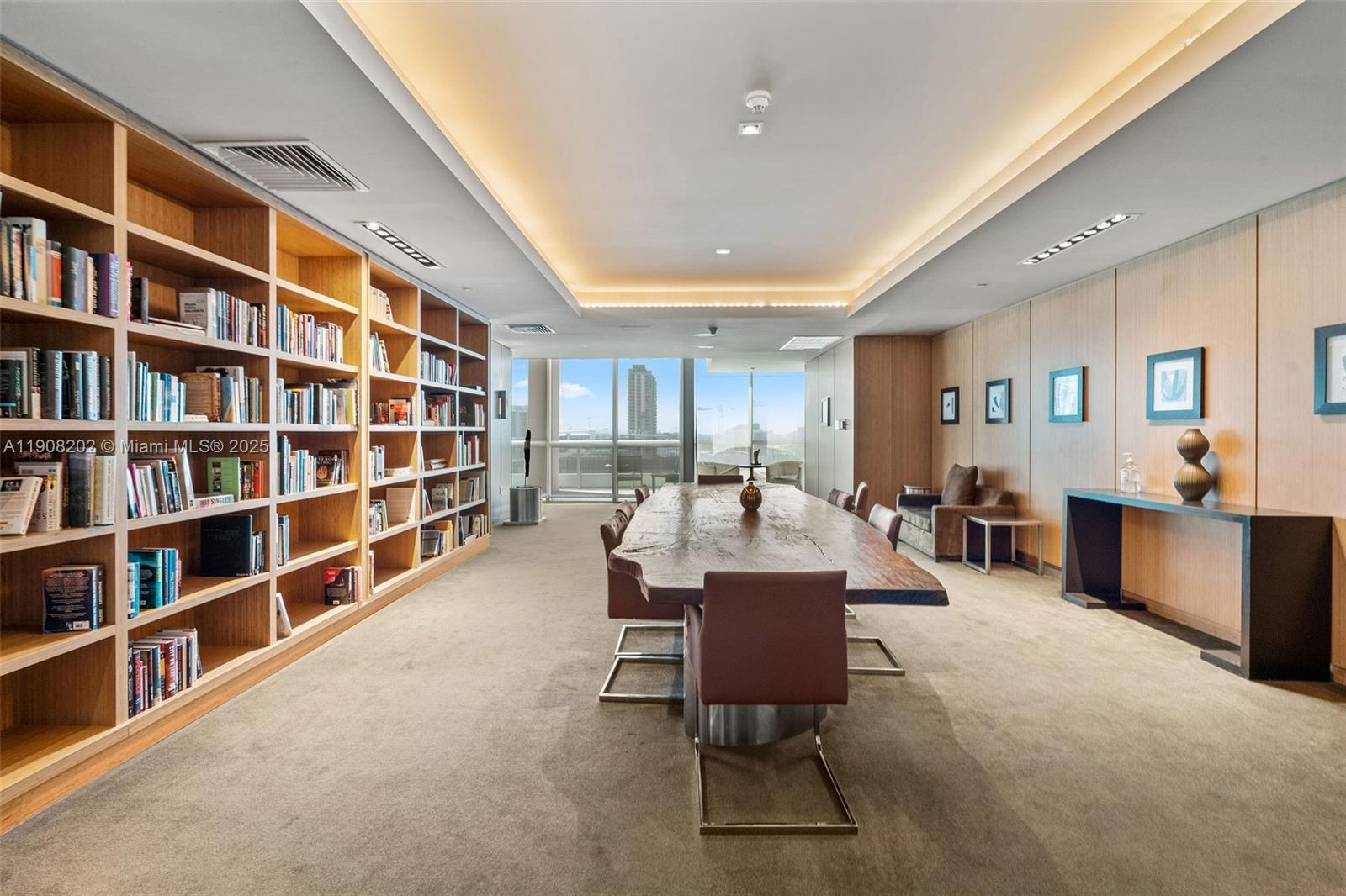 900 Biscayne Boulevard, Unit PH6201 Miami, FL 33132 - Photo 64 of 73 a living room with furniture and a book shelf