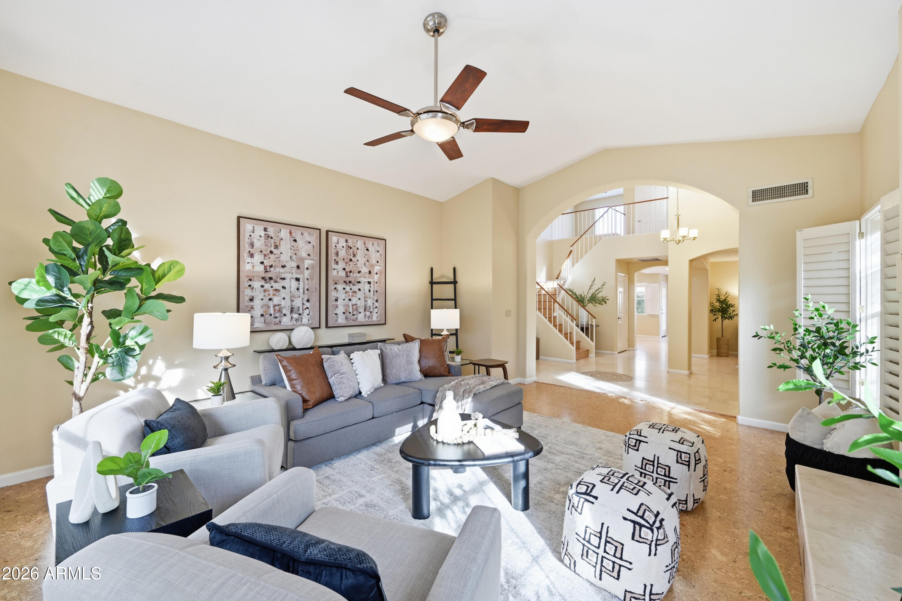 9502 East Presidio Road Scottsdale, AZ 85260 - Photo 11 of 39 a living room with furniture and a chandelier