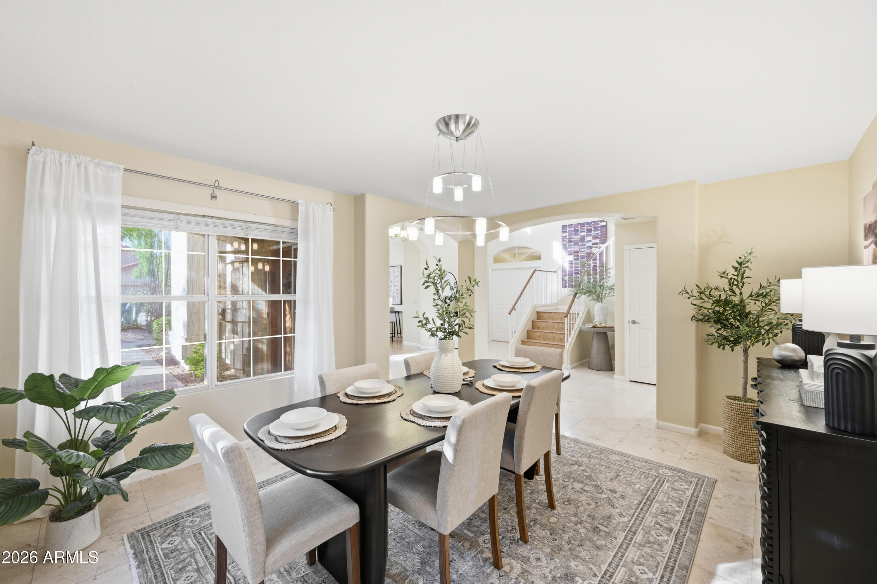 9502 East Presidio Road Scottsdale, AZ 85260 - Photo 13 of 39 a view of a dining room with furniture window and wooden floor