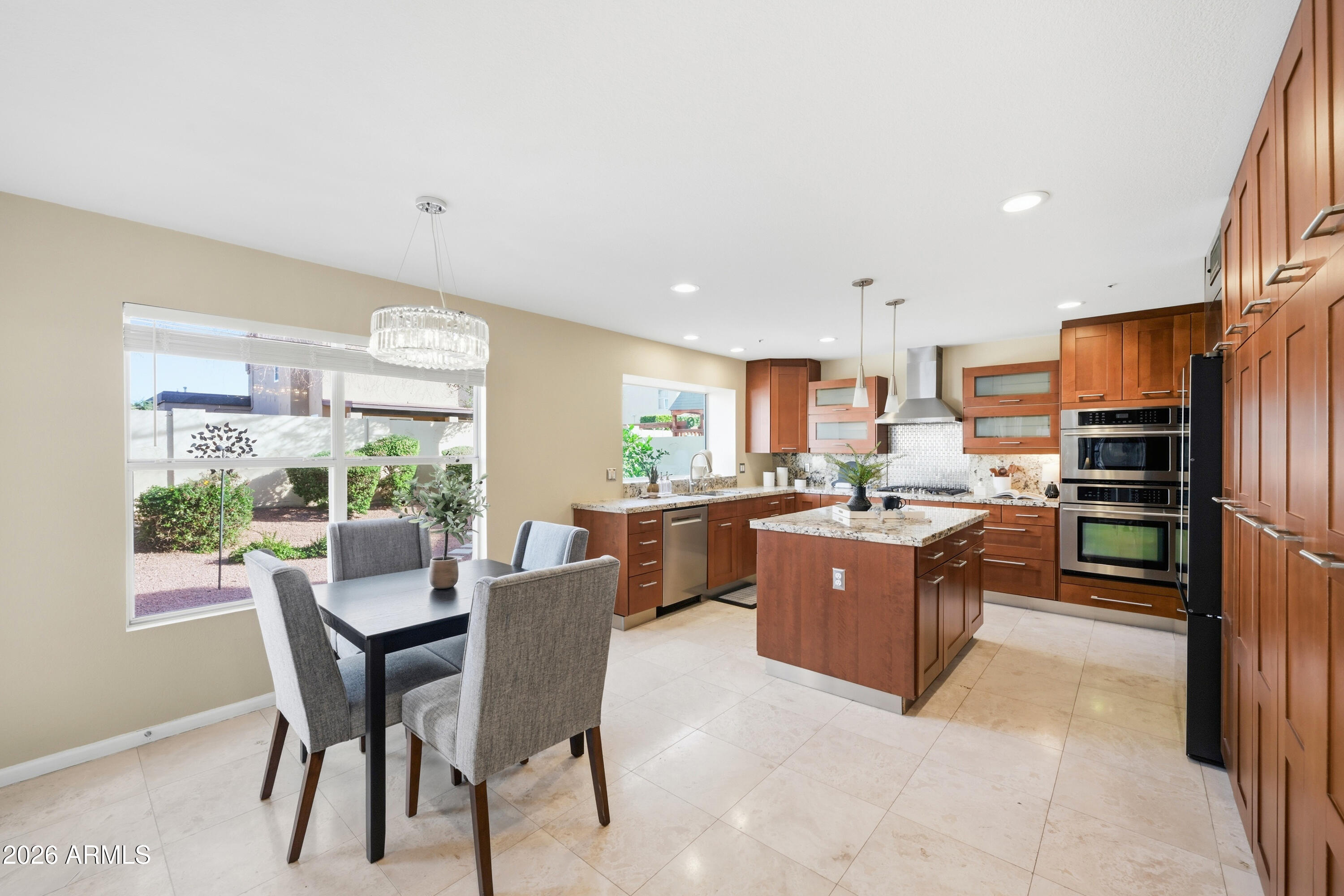 9502 East Presidio Road Scottsdale, AZ 85260 - Photo 14 of 39 a large kitchen with a table and chairs
