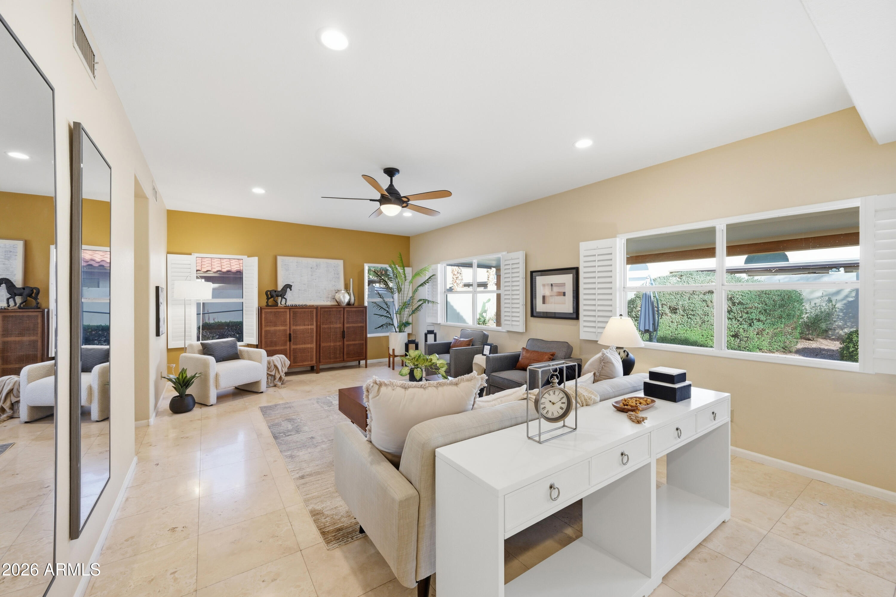 9502 East Presidio Road Scottsdale, AZ 85260 - Photo 19 of 39 a living room with furniture potted plant and a large window